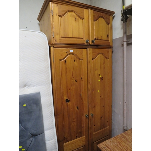 911 - A HONEY PINE DOUBLE WARDROBE WITH TOP BOX