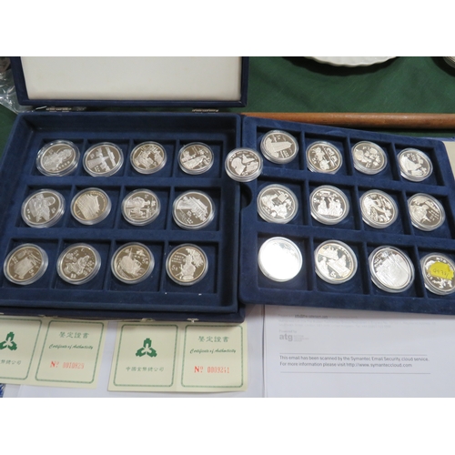 145 - CHINA - A COLLECTION OF MODERN SILVER PROOF 5 AND 10 YUAN COINS, in a blue presentation box (25 coin... 