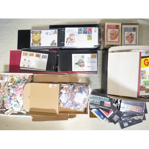 152 - THREE ALBUMS OF FIRST DAY COVERS, together with three boxes of loose stamps and loose sleeves of sta... 