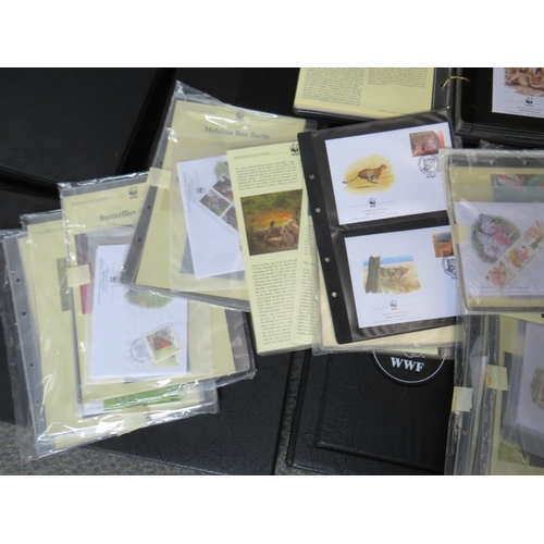 153 - TWELVE ALBUMS OF STAMPS / FIRST DAY COVERS, world wildlife 1983 to 2003, together with a bag of loos... 