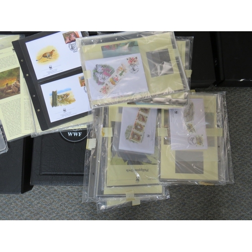 153 - TWELVE ALBUMS OF STAMPS / FIRST DAY COVERS, world wildlife 1983 to 2003, together with a bag of loos... 