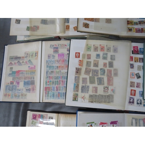 172 - TWELVE STAMP ALBUMS / STOCKBOOKS, containing stamps from Romania, Finland, Hungary, Belgium etc.