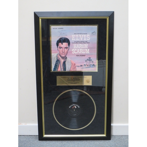 230 - A MOUNTED ELVIS PRESLEY HARUM SCARUM RCA VICTOR VINYL RECORD AND RECORD SLEEVE, signed by Elvis Pres... 