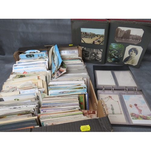 213 - TWO VINTAGE POSTCARDS ALBUMS, together with a tray of loose postcards with many vintage examples