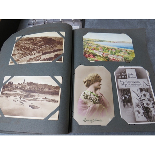 213 - TWO VINTAGE POSTCARDS ALBUMS, together with a tray of loose postcards with many vintage examples