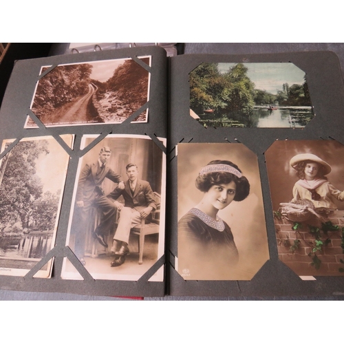 213 - TWO VINTAGE POSTCARDS ALBUMS, together with a tray of loose postcards with many vintage examples