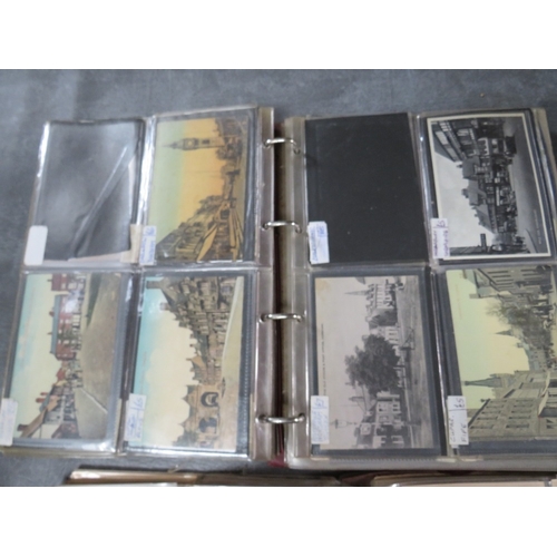 219 - FOUR POSTCARD ALBUMS AND CONTENTS, contents to include vintage examples, British street scenes etc. ... 