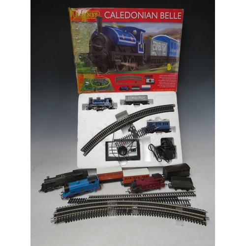 392 - A BOXED HORNBY '00' GAUGE CALEDONIAN BELLE TRAIN SET, complete but box A/F, together with three unbo... 