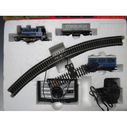 392 - A BOXED HORNBY '00' GAUGE CALEDONIAN BELLE TRAIN SET, complete but box A/F, together with three unbo... 