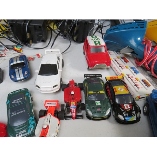 439 - A BOXED MICRO SCALEXTRIC, with track, cars, transformer and hand controls, together with a box of mi... 