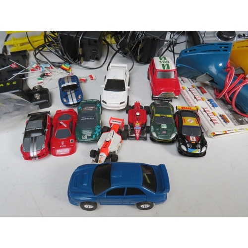 439 - A BOXED MICRO SCALEXTRIC, with track, cars, transformer and hand controls, together with a box of mi... 