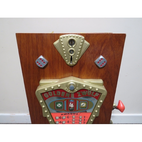 521 - A VINTAGE GOLDEN ZWOLF (12) WOOD CASED WALL MOUNTED ONE ARM BANDIT ARCADE MACHINE, working on pennie... 