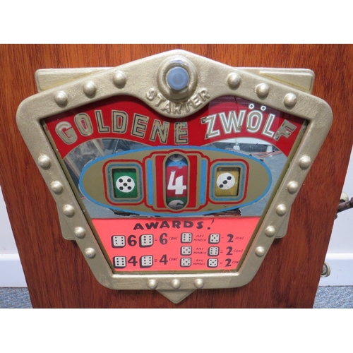 521 - A VINTAGE GOLDEN ZWOLF (12) WOOD CASED WALL MOUNTED ONE ARM BANDIT ARCADE MACHINE, working on pennie... 