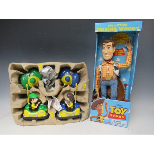 425 - A DISNEY TOY STORY PULL STRING TALKING WOODY IN ORIGINAL BOX, together with a pair of remote control... 