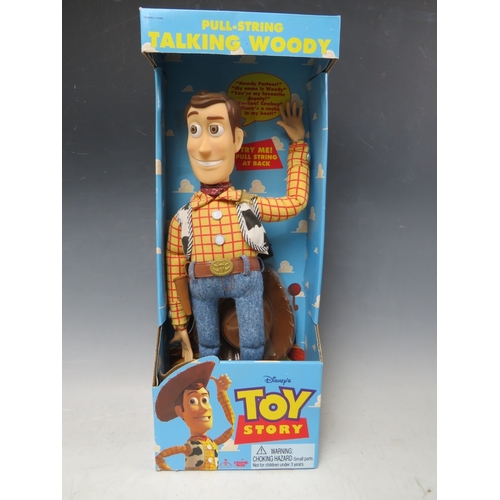 425 - A DISNEY TOY STORY PULL STRING TALKING WOODY IN ORIGINAL BOX, together with a pair of remote control... 