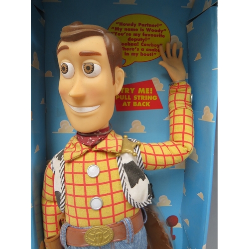 425 - A DISNEY TOY STORY PULL STRING TALKING WOODY IN ORIGINAL BOX, together with a pair of remote control... 