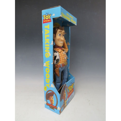 425 - A DISNEY TOY STORY PULL STRING TALKING WOODY IN ORIGINAL BOX, together with a pair of remote control... 