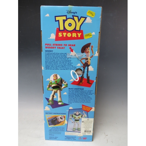 425 - A DISNEY TOY STORY PULL STRING TALKING WOODY IN ORIGINAL BOX, together with a pair of remote control... 