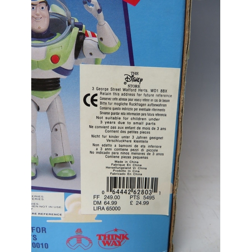 425 - A DISNEY TOY STORY PULL STRING TALKING WOODY IN ORIGINAL BOX, together with a pair of remote control... 