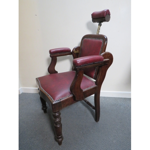 510 - A LATE VICTORIAN BARBERS / DENTISTS CHAIR, with upholstered mahogany frame, adjustable centrifugal p... 