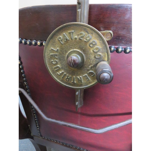 510 - A LATE VICTORIAN BARBERS / DENTISTS CHAIR, with upholstered mahogany frame, adjustable centrifugal p... 