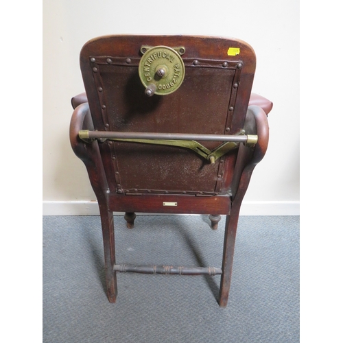 511 - A LATE VICTORIAN BARBERS / DENTISTS CHAIR, with upholstered mahogany frame, with reclining back rest... 