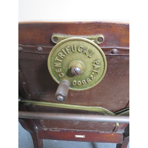 511 - A LATE VICTORIAN BARBERS / DENTISTS CHAIR, with upholstered mahogany frame, with reclining back rest... 