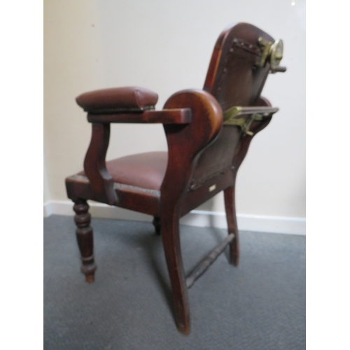 511 - A LATE VICTORIAN BARBERS / DENTISTS CHAIR, with upholstered mahogany frame, with reclining back rest... 