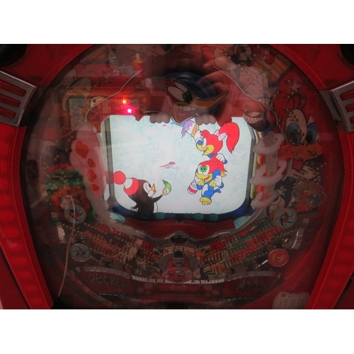 524 - A VINTAGE JAPANESE ? WALL MOUNTED ELECTRICAL WOODY WOODPECKER ARCADE PINBALL MACHINE, with key and b... 