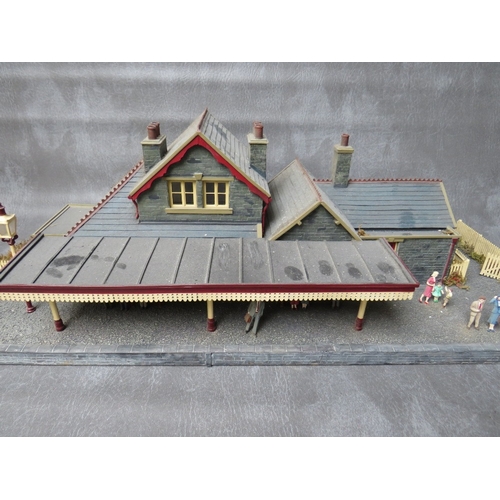 399 - THREE BOXES OF 00 GAUGE BUILDINGS, both plastic and card, together with 00 gauge model station build... 