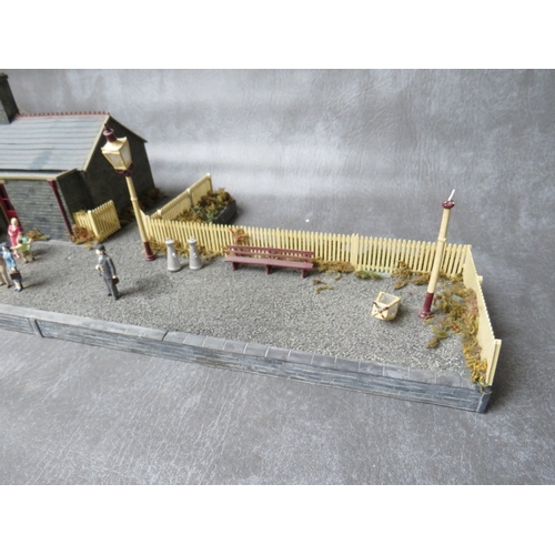 399 - THREE BOXES OF 00 GAUGE BUILDINGS, both plastic and card, together with 00 gauge model station build... 