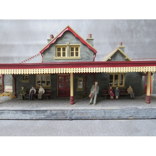 399 - THREE BOXES OF 00 GAUGE BUILDINGS, both plastic and card, together with 00 gauge model station build... 