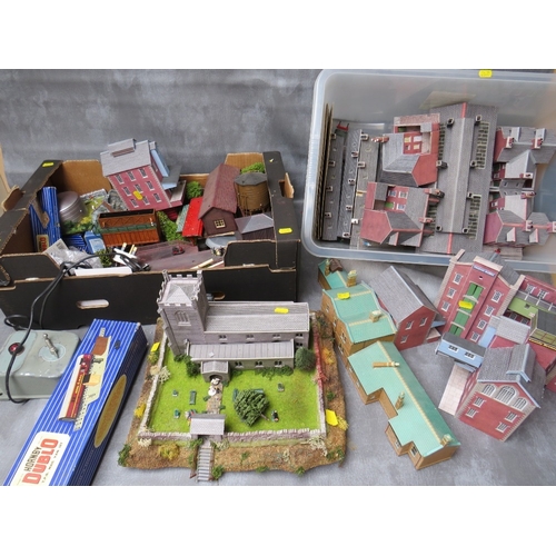 415 - THREE TRAYS OF 00 GAUGE RAILWAY LAYOUT BUILDINGS, platforms and scenery, together with a transformer... 