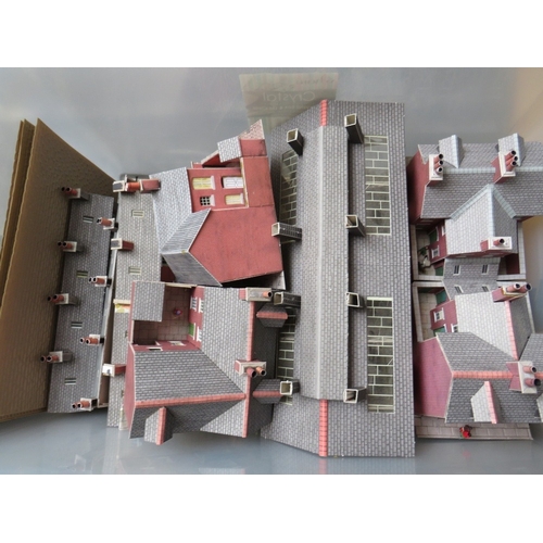 415 - THREE TRAYS OF 00 GAUGE RAILWAY LAYOUT BUILDINGS, platforms and scenery, together with a transformer... 