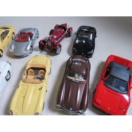 489 - A COLLECTION OF UNBOXED DIE CAST CARS AND FIGURES, cars mainly 1:18 scale by Burago, Maisto etc., fi... 