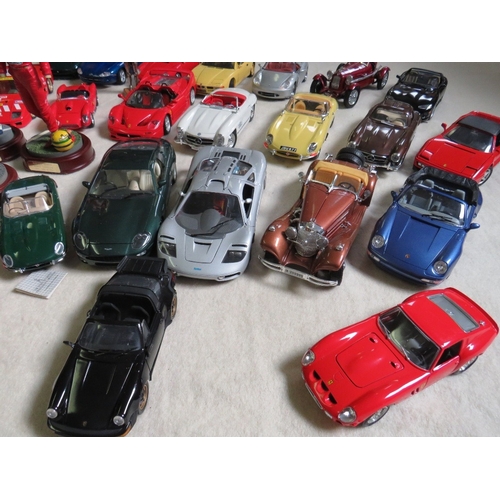 489 - A COLLECTION OF UNBOXED DIE CAST CARS AND FIGURES, cars mainly 1:18 scale by Burago, Maisto etc., fi... 