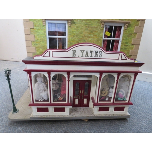 360 - AN EXCELLENT QUALITY ROTATING BASE DOLLS HOUSE, complete with fixed furniture, has shop frontage, H ... 