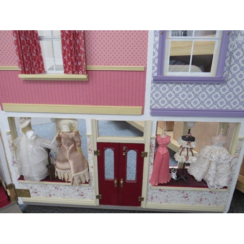 360 - AN EXCELLENT QUALITY ROTATING BASE DOLLS HOUSE, complete with fixed furniture, has shop frontage, H ... 