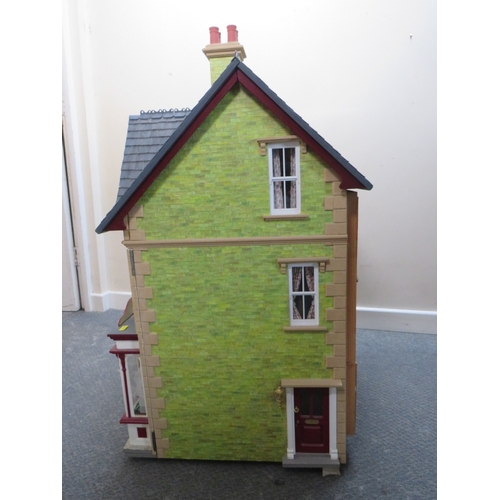 360 - AN EXCELLENT QUALITY ROTATING BASE DOLLS HOUSE, complete with fixed furniture, has shop frontage, H ... 