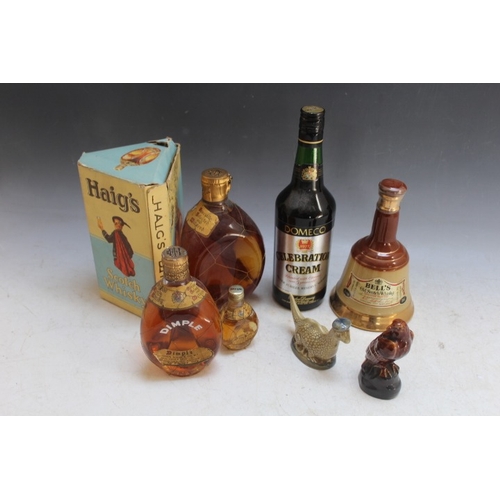 251 - A VINTAGE BOTTLE OF DIMPLE WHISKY IN ORIGINAL BOX, together with a smaller example, Beswick miniatur... 