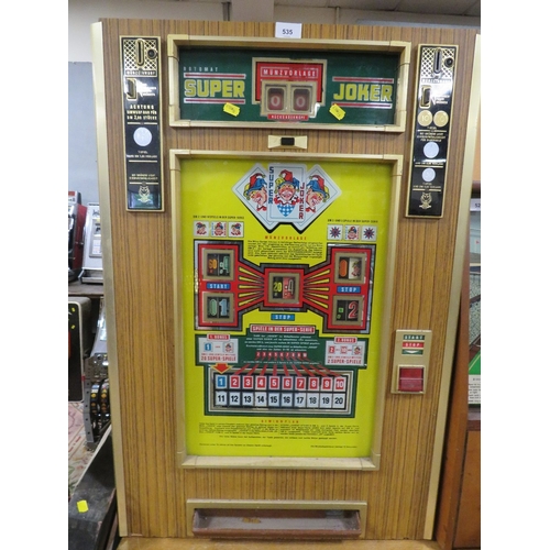 535 - A VINTAGE ROTOMAT SUPER JOKER WALL MOUNTED FRUIT MACHINE, set up for the German market, H 88 cm