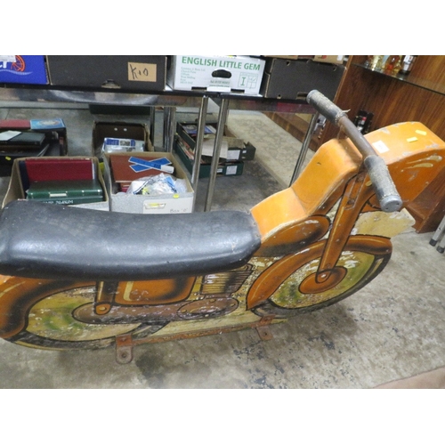 538 - A FAIRGROUND PAINTED WOOD CAROUSEL MOTORBIKE, with polychrome decoration, on metal bracket stand (Re... 