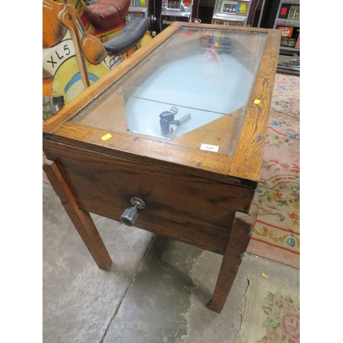 539 - A VINTAGE 'R & W' ICE HOCKEY GAME, of mainly wood construction, with glaze top, fitted with coin ope... 