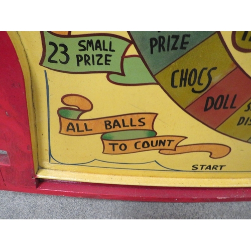 568 - 'BEAT THE CLOCK' A MID 20TH CENTURY PAINTED WOOD FAIRGROUND ROLL A BALL GAME BOARD, in red and yello... 