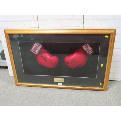 311 - FRAMED HENRY COOPER AND NIGEL BENN BOXING GLOVES, both autographed