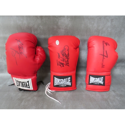 318 - THREE SIGNED BOXING GLOVES, to include Frank Bruno, Riddick Bowe and Ernie Terrell