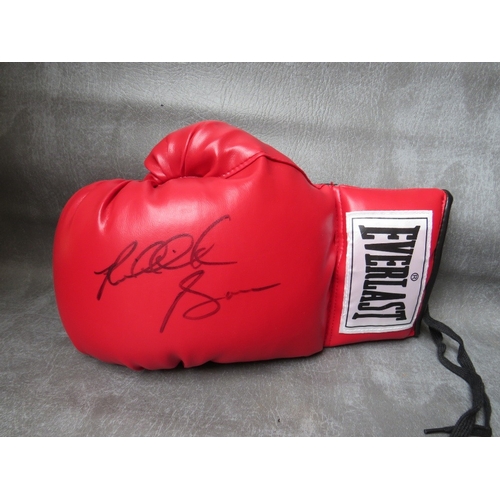 318 - THREE SIGNED BOXING GLOVES, to include Frank Bruno, Riddick Bowe and Ernie Terrell