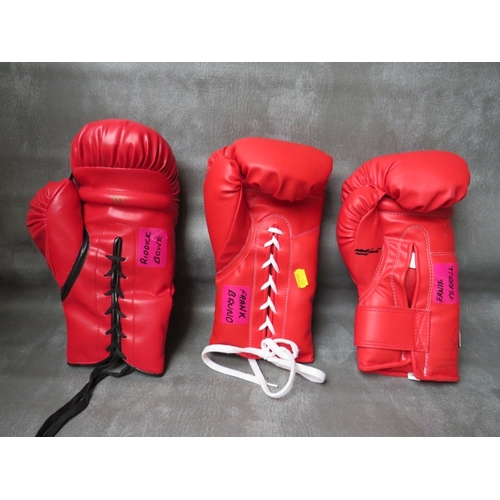 318 - THREE SIGNED BOXING GLOVES, to include Frank Bruno, Riddick Bowe and Ernie Terrell