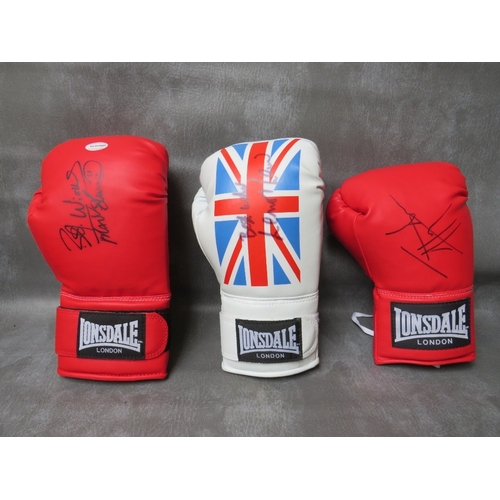 321 - THREE SIGNED BOXING GLOVES, to include Lennox Lewis, Frank Bruno and Johnny Nelson