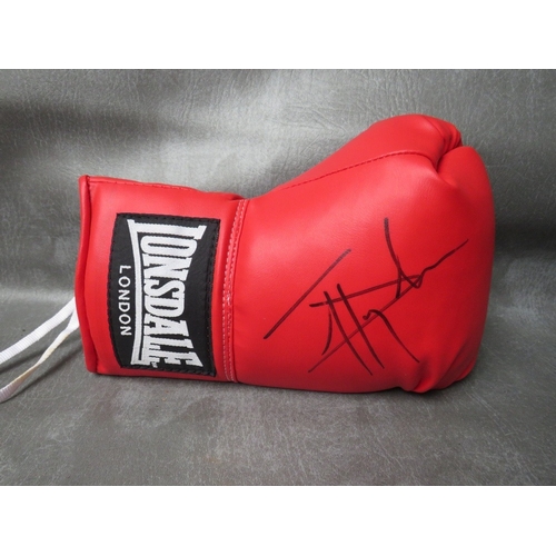 321 - THREE SIGNED BOXING GLOVES, to include Lennox Lewis, Frank Bruno and Johnny Nelson